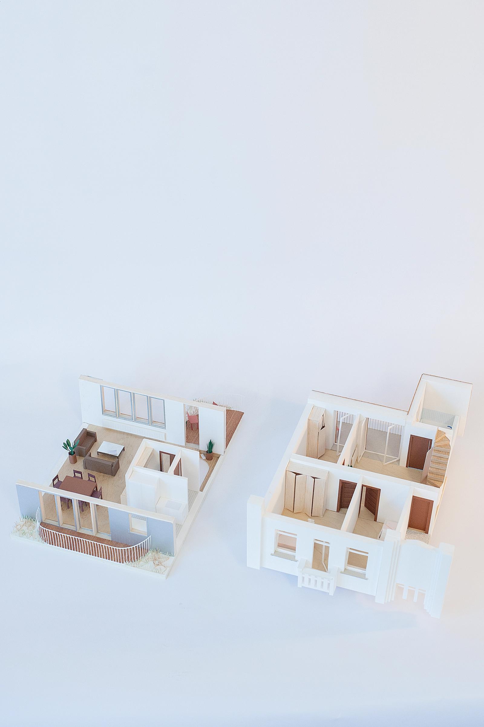 Pair of white apartment models showing alternative arrangements