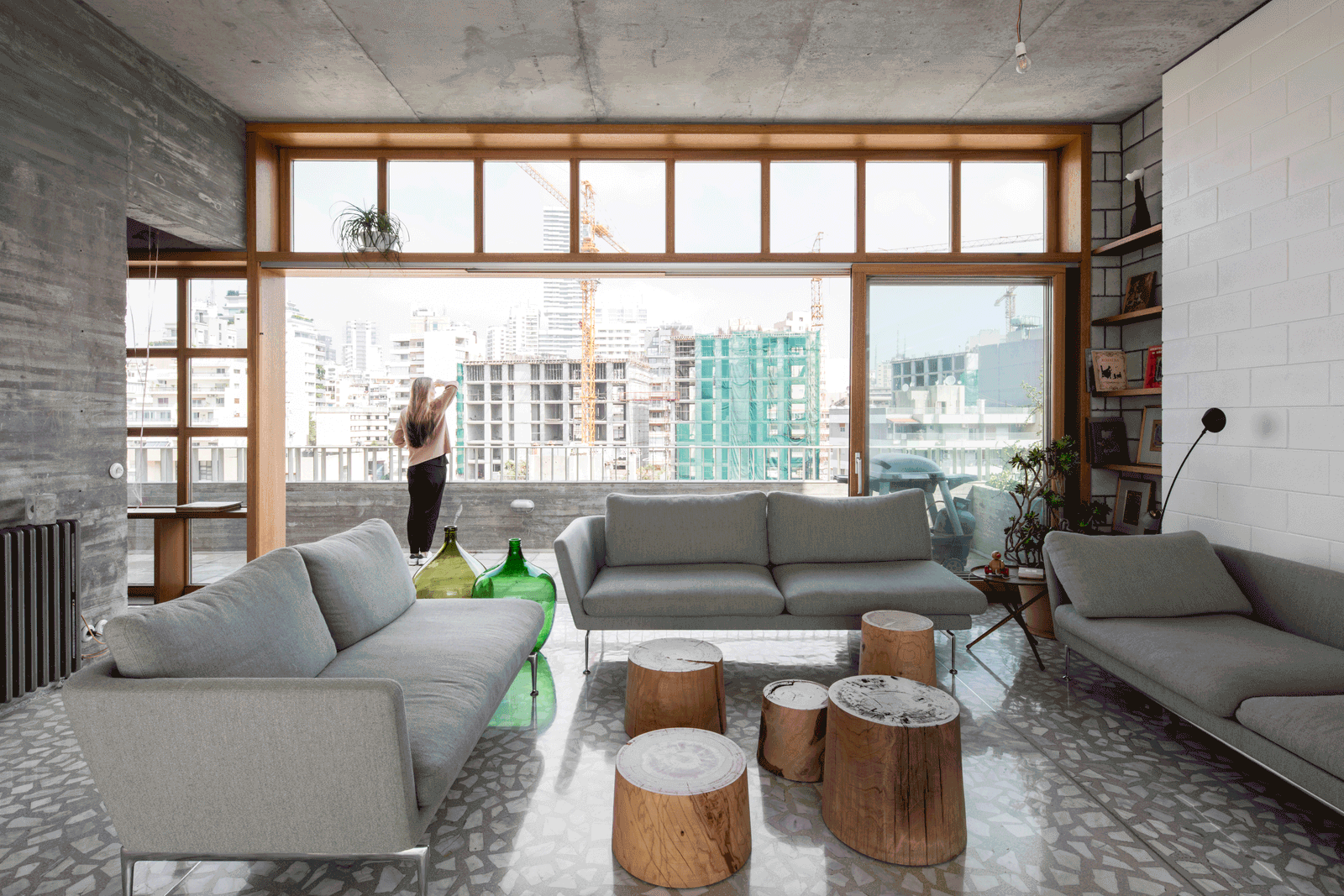 Living room facing a full-width timber-framed city window