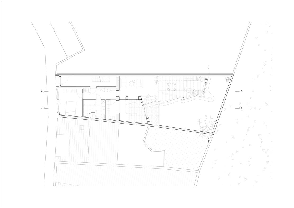 Ground plan of a small extension set into a sloping garden