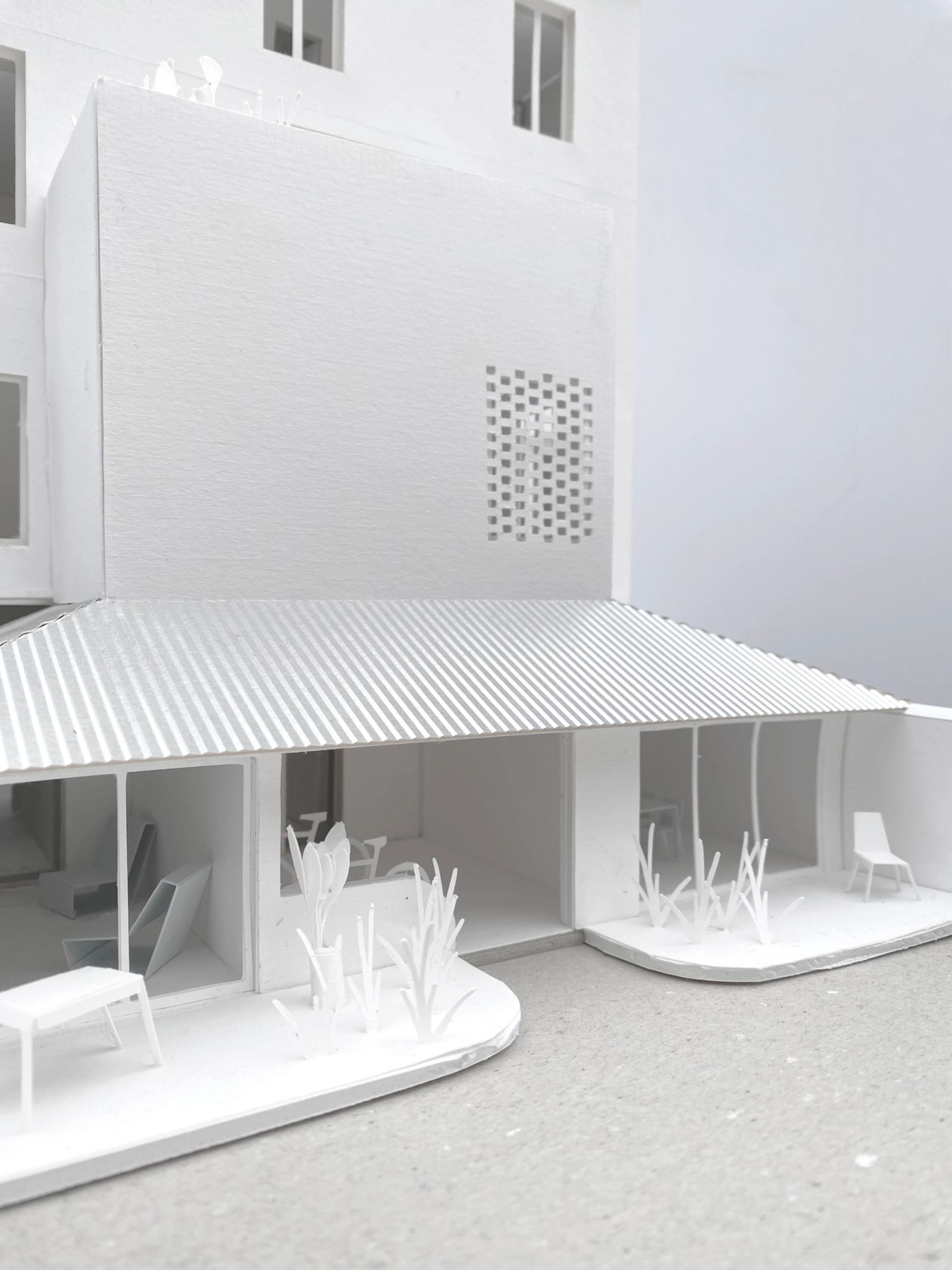 Close view of the model courtyard and striped canopy