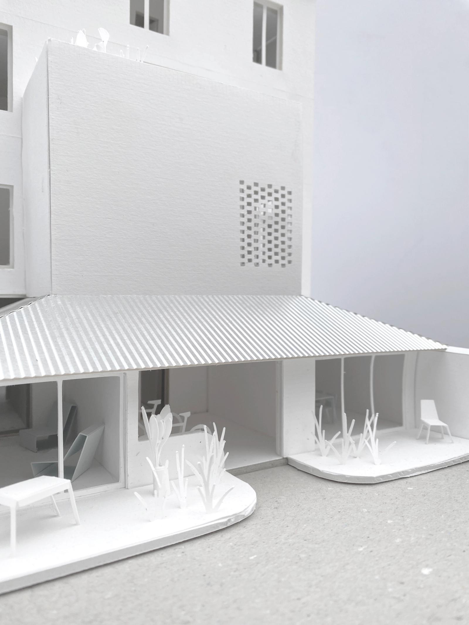 Close view of the model courtyard and striped canopy