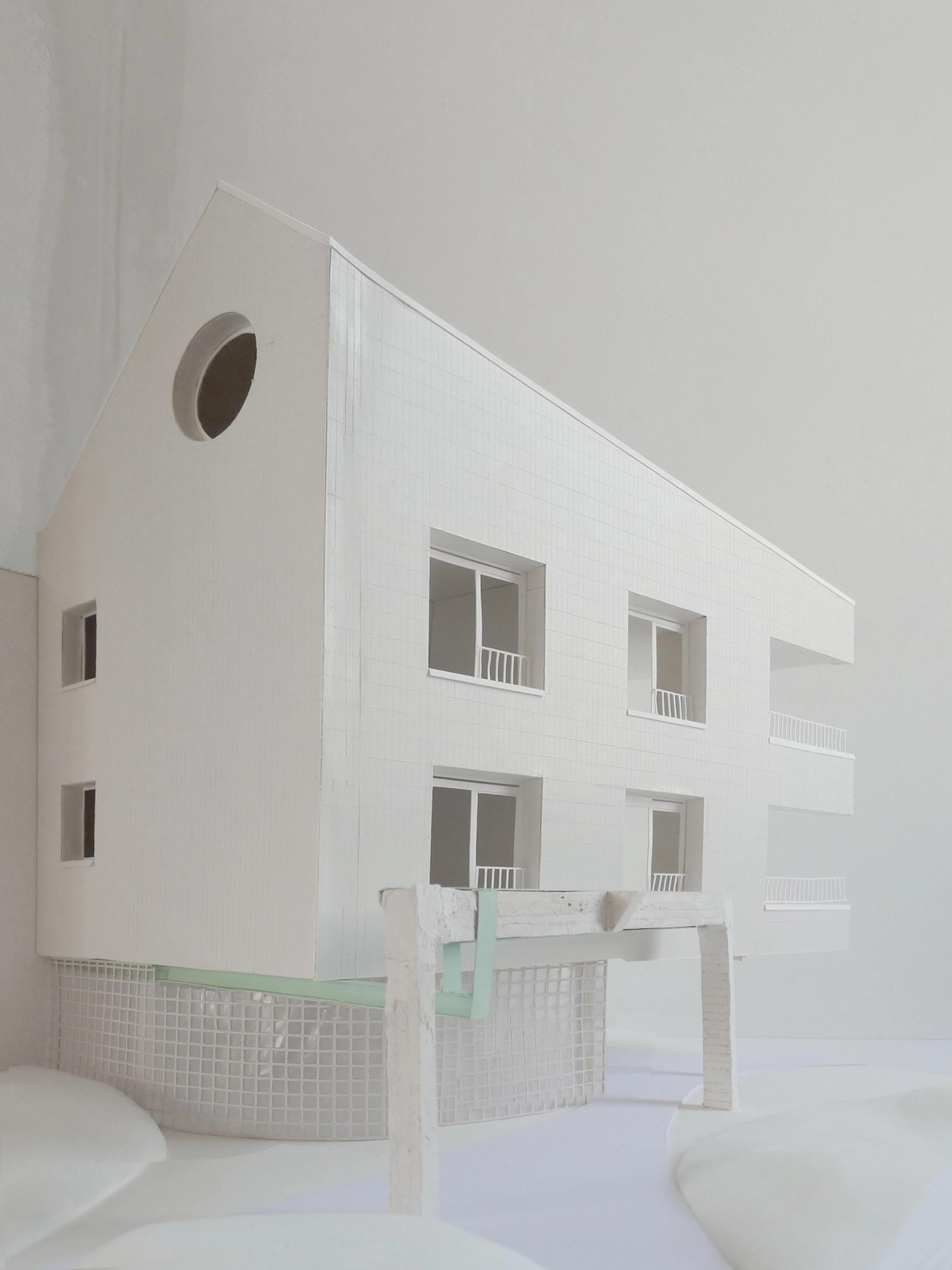 White physical model of a gabled residential building