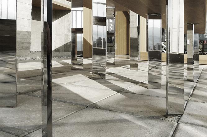 Mirrored table legs reflecting the surrounding terrace
