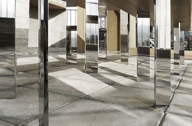 Mirrored table legs reflecting the surrounding terrace