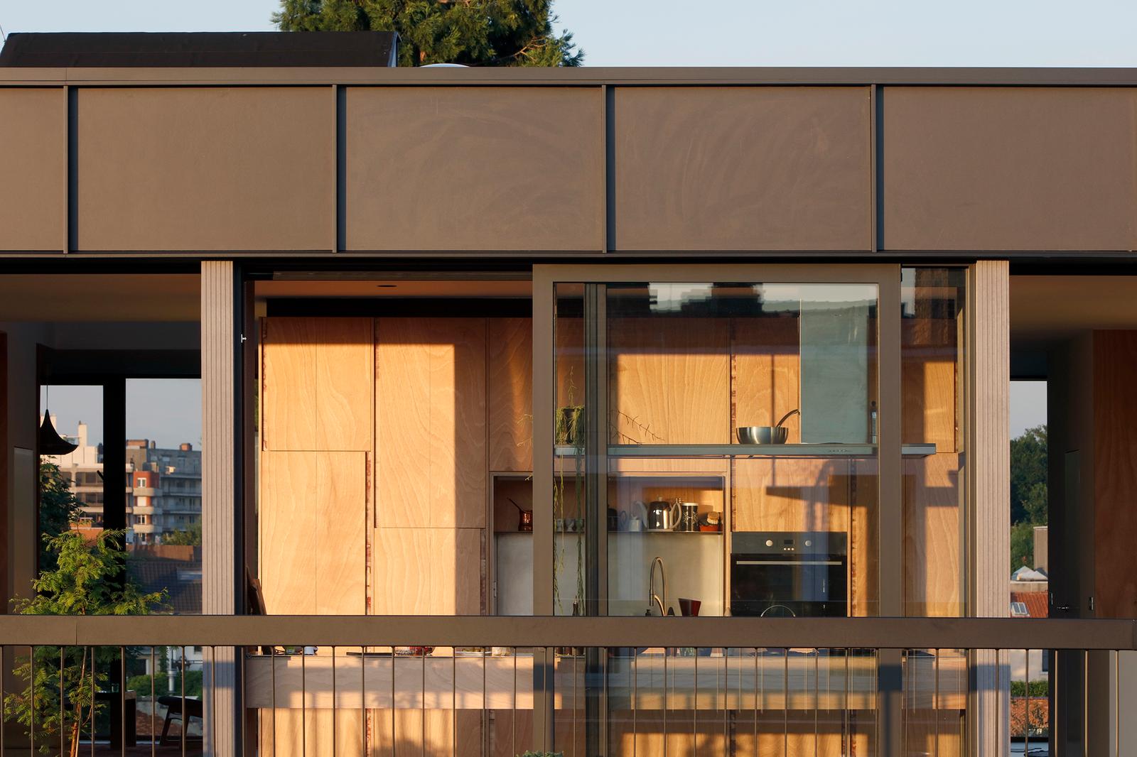 Terrace view through glazing to the timber kitchen and dining area