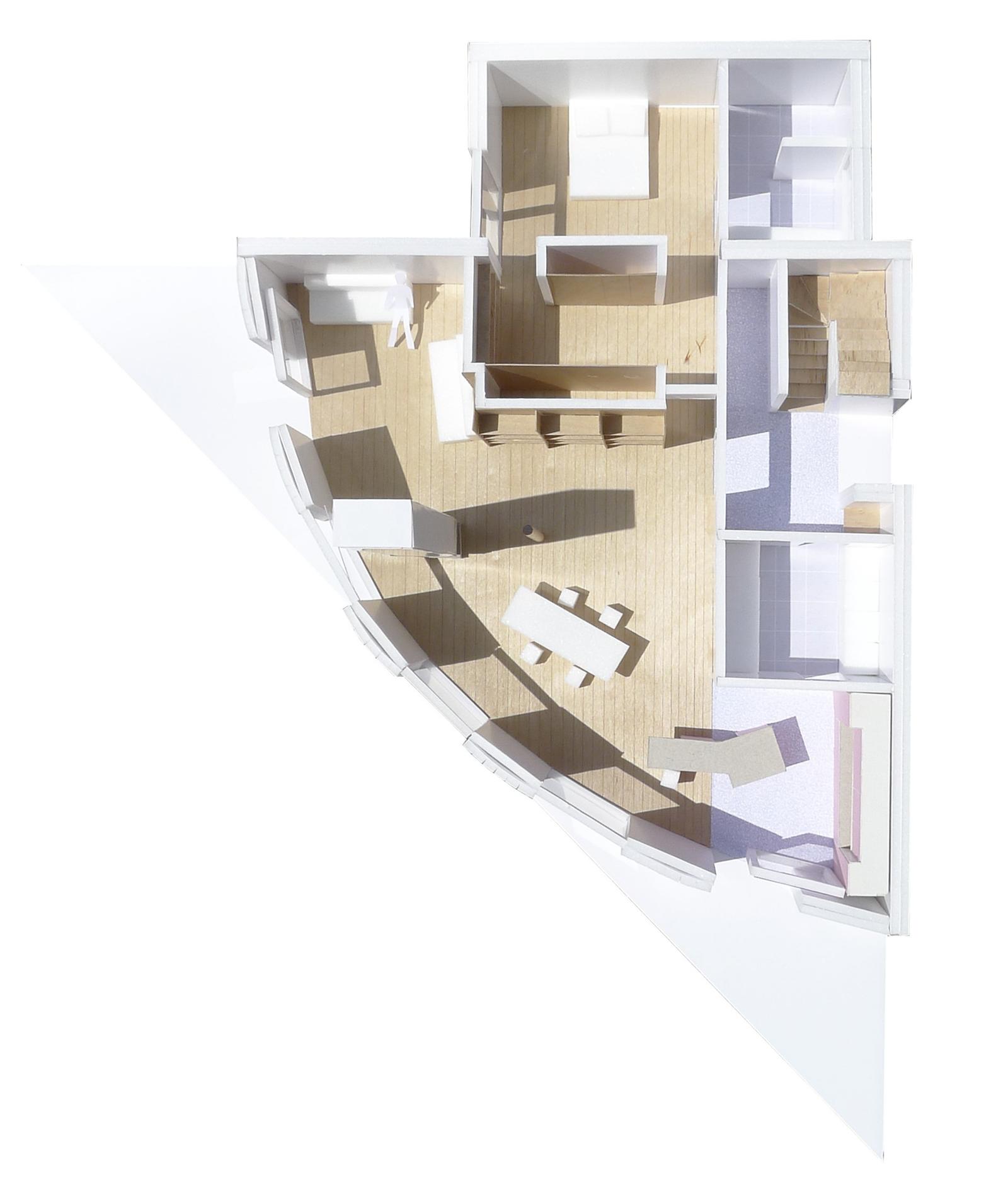 Cutaway physical model showing rooms within the triangular floor plan