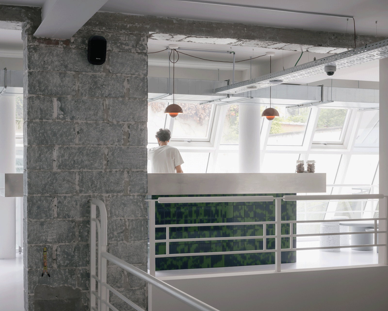 Mezzanine railing overlooking the bright juice bar below