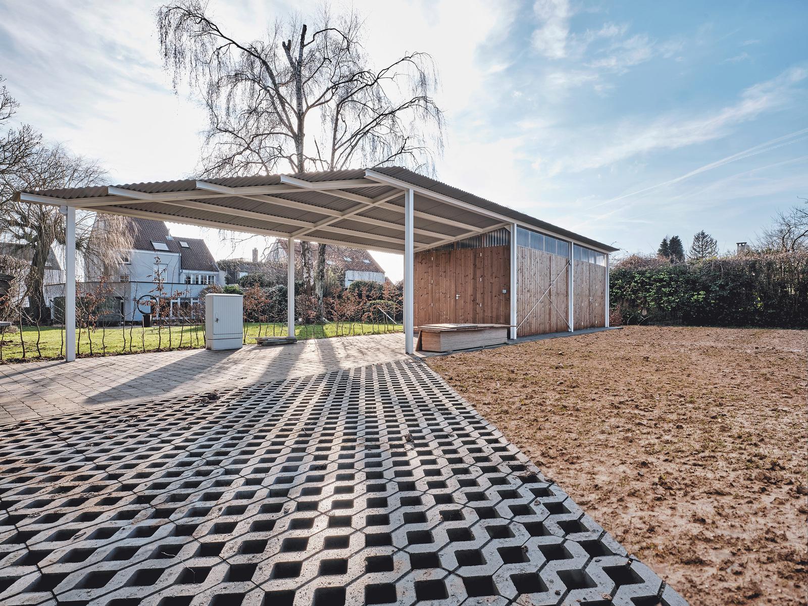 Open garden canopy above a lattice of planted paving