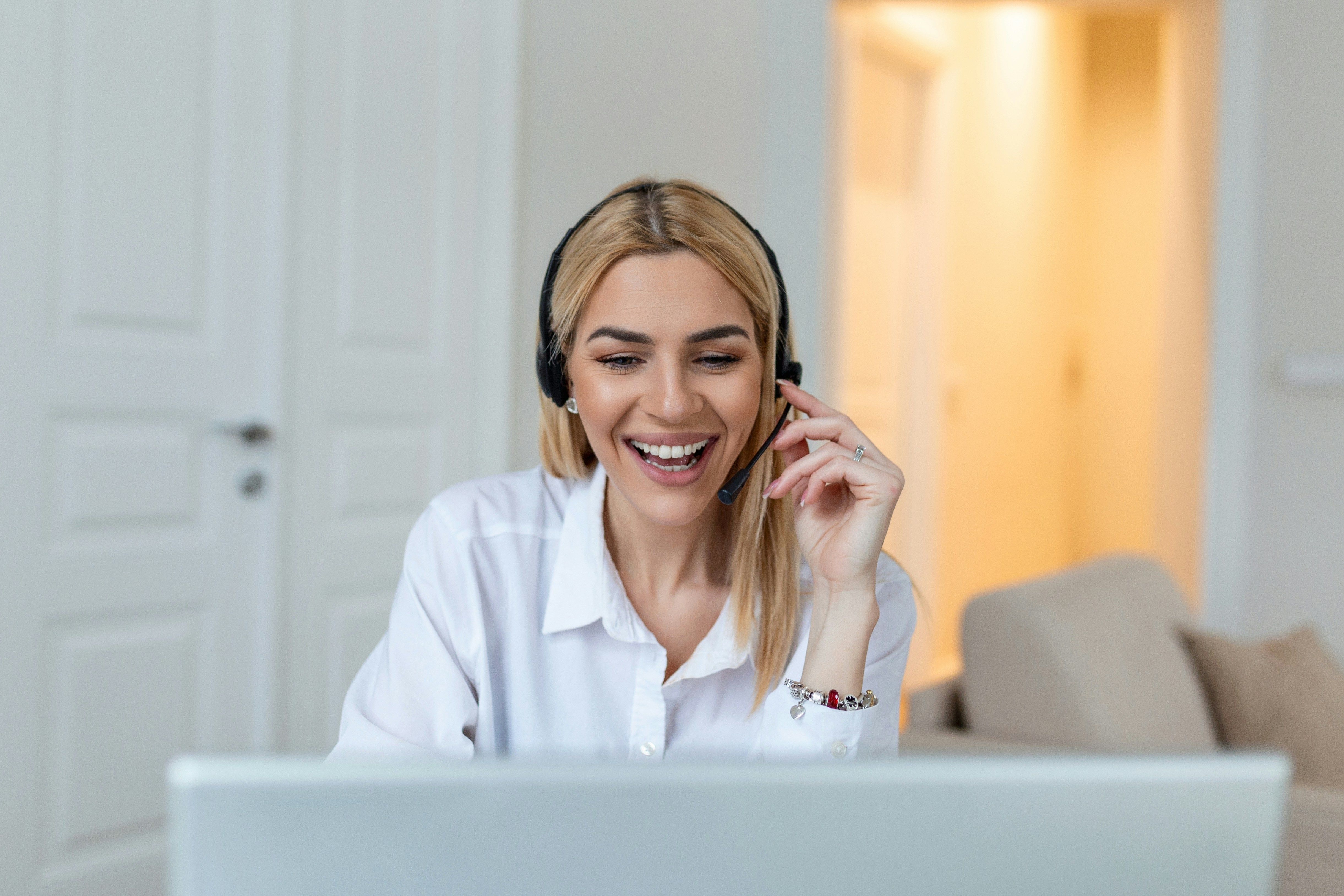 woman with headset laughing