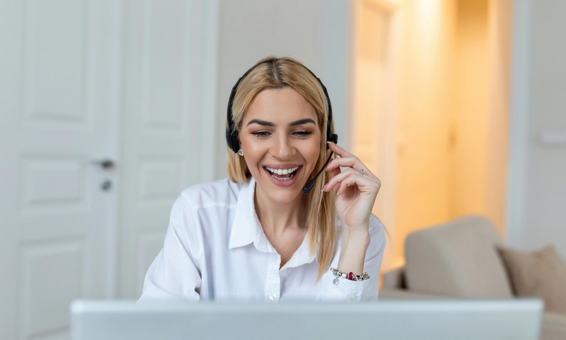 woman with headset laughing