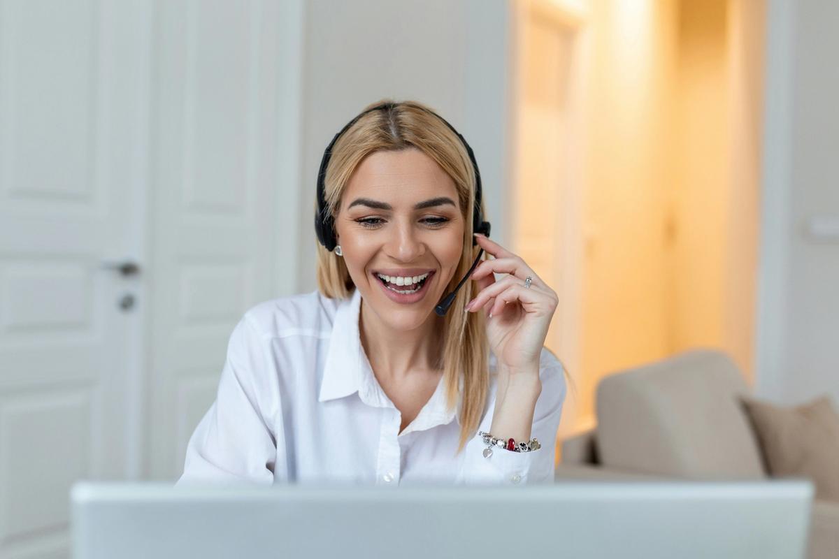 woman with headset laughing