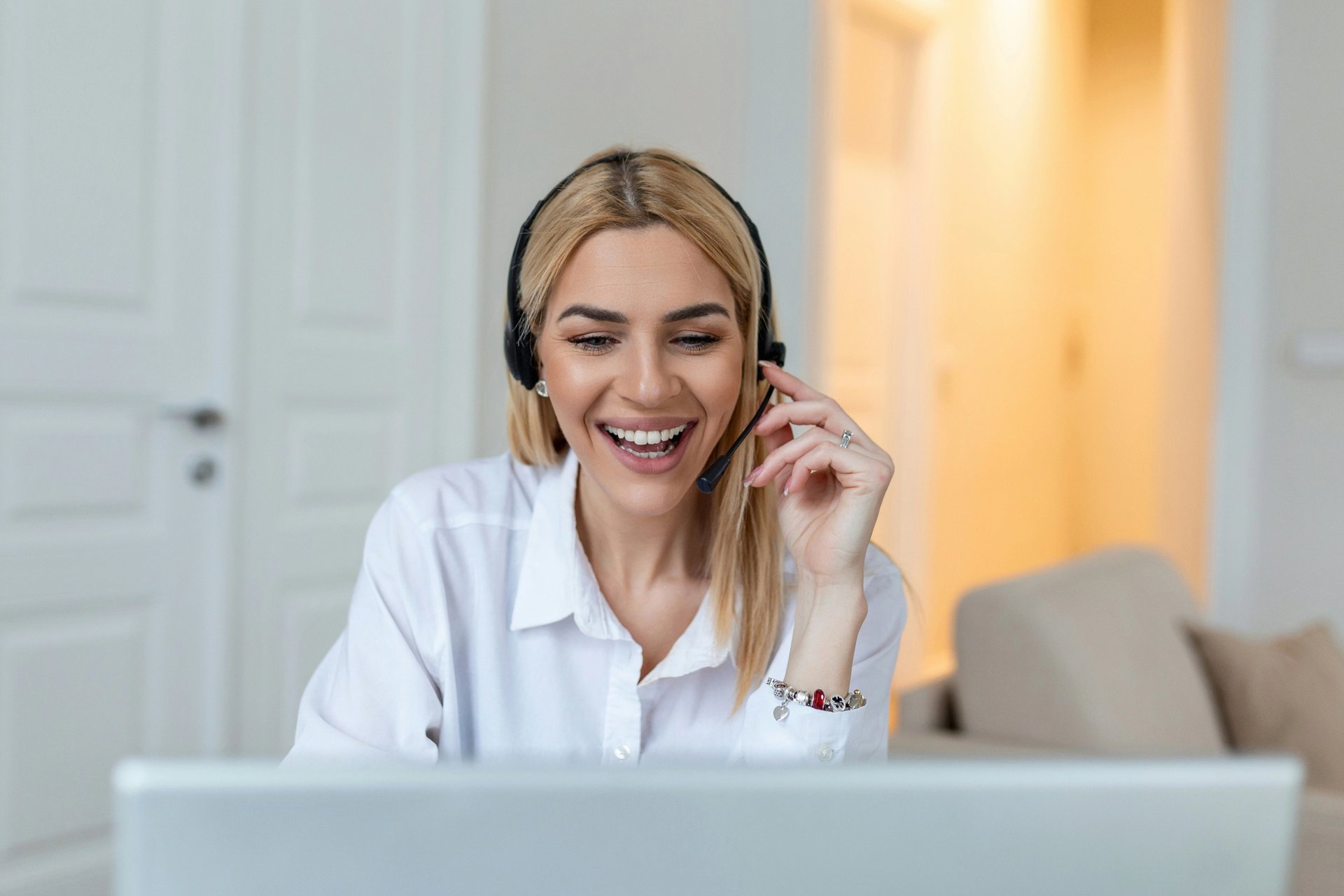 woman with headset laughing