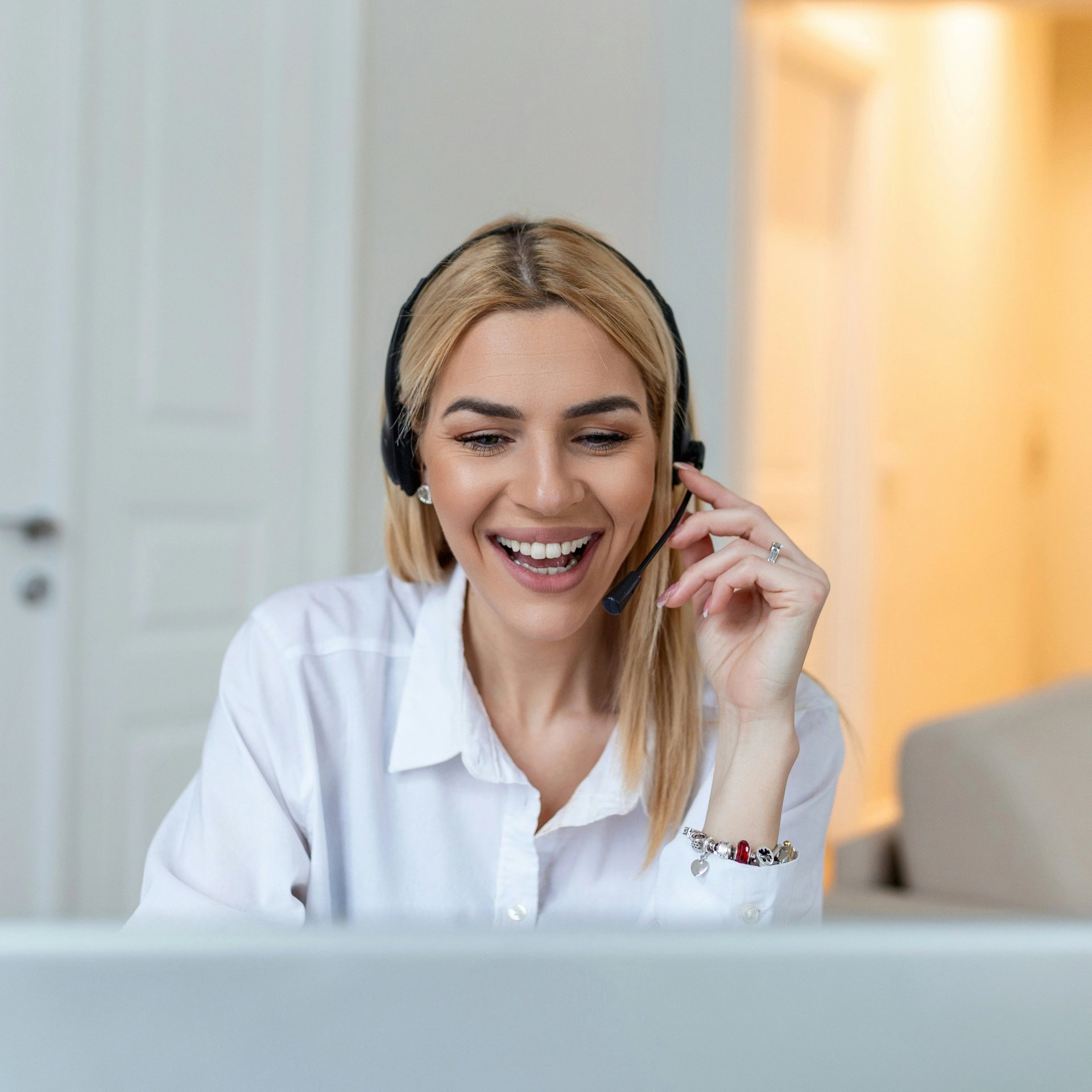 woman with headset laughing