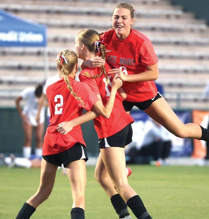 The Lake Mary girls’ soccer team celebrates after winning the state title for the second year in a row.