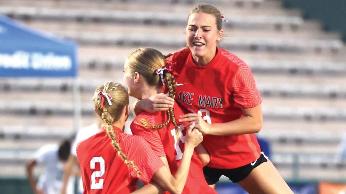 The Lake Mary girls’ soccer team celebrates after winning the state title for the second year in a row.