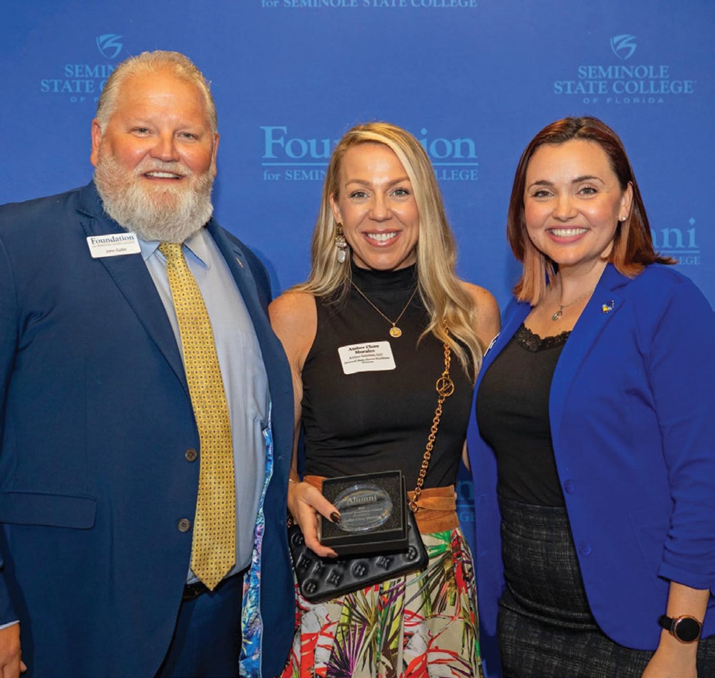 Amber Clore Morales (middle) with Seminole State Vice President John Gyllin and former Director of Development Laura Schumacher. Amber received recognition as an Alumni Excellence Honoree in 2023.