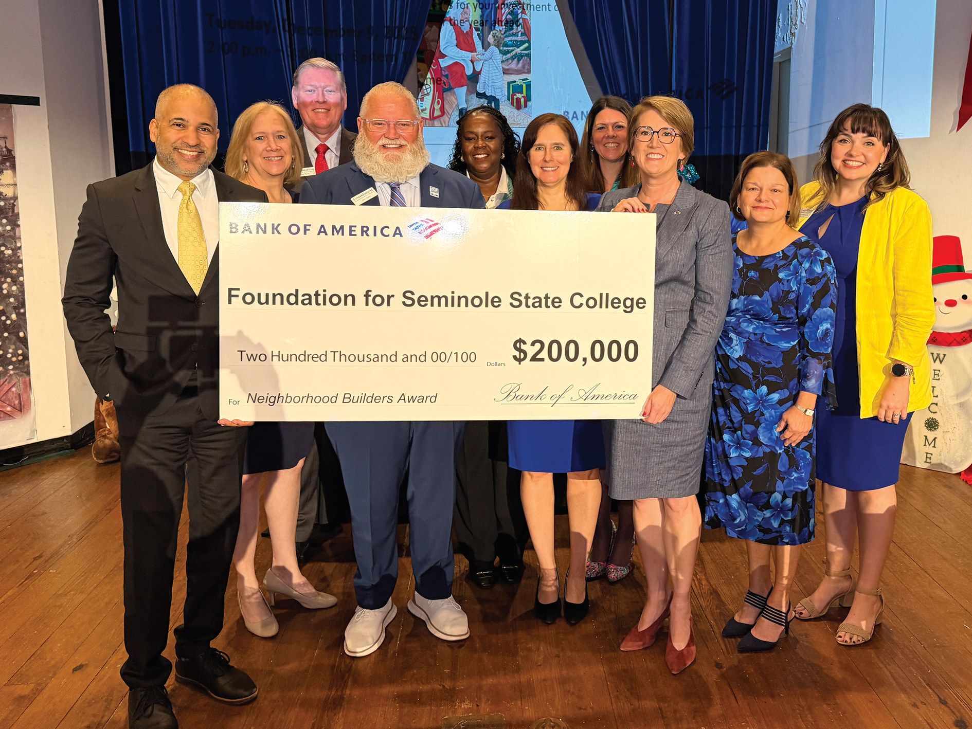 Bank of America and Seminole State leaders hold the $200,000 check Seminole State College earned as the newest Neighborhood Builder honoree.