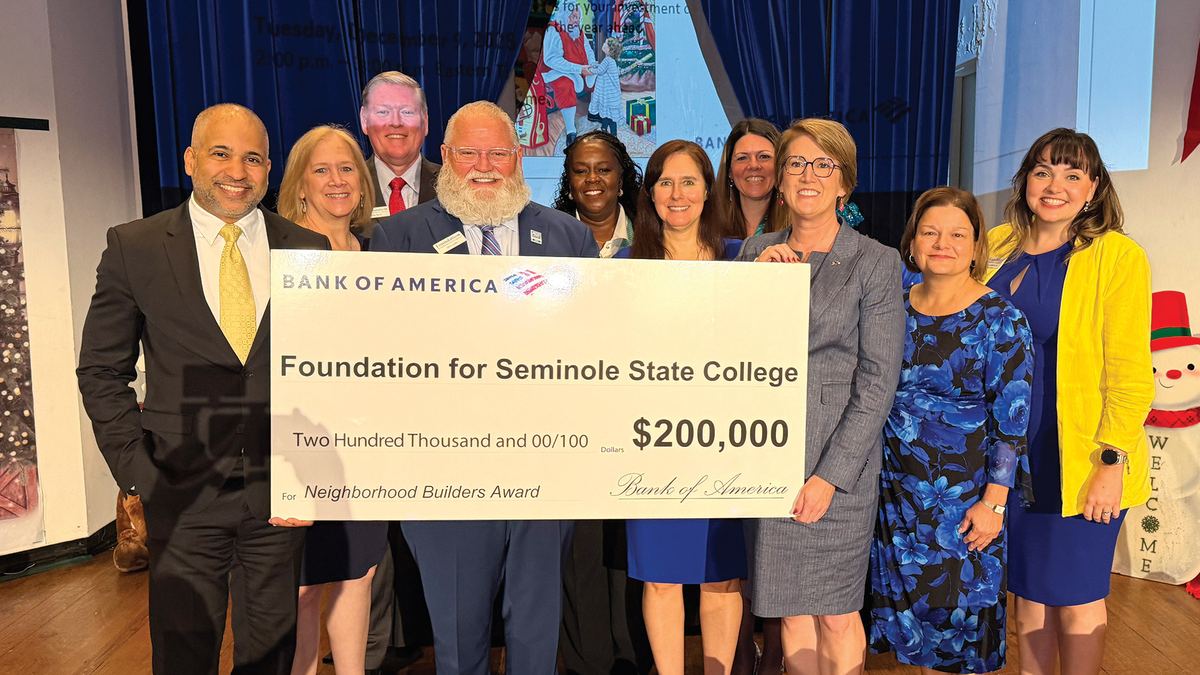 Bank of America and Seminole State leaders hold the $200,000 check Seminole State College earned as the newest Neighborhood Builder honoree.