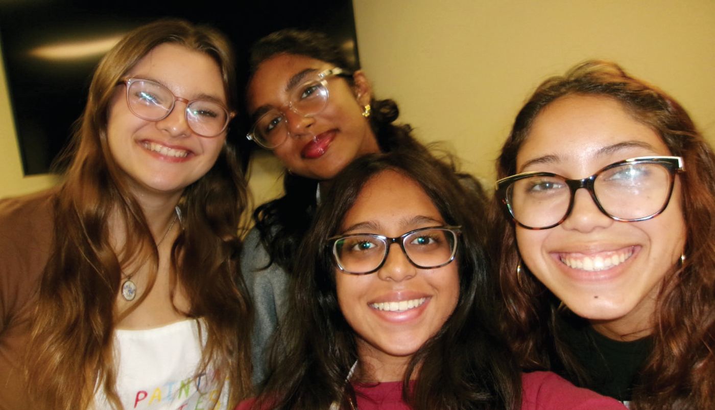 Lucy Young, Sasha Cherukuri, Deeksha Kamesh, and Loey Page Sydes of Painting Smiles