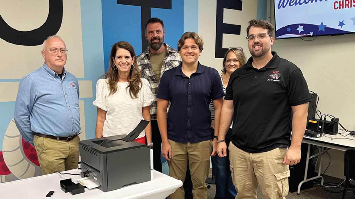 Front row: Rich Wagers, senior IT technician; Supervisor of Elections Amy Pennock, student Ethan Sigal, and teacher Christopher Endress. Back row: Ethan’s parents, Alex Sigal and Rachel Bland