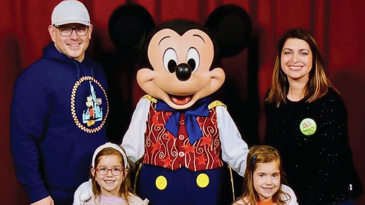 Adam Fox, owner of Fox Estate Buyers, with his wife Flora, daughters Ava and Alexandra, and Mickey Mouse