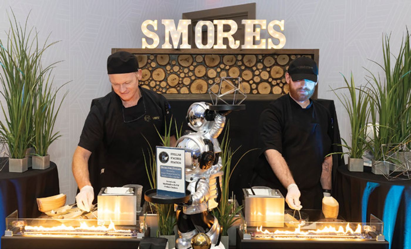 Chefs prepare delicious s’mores at the Celeste Hotel’s five-year anniversary celebration.