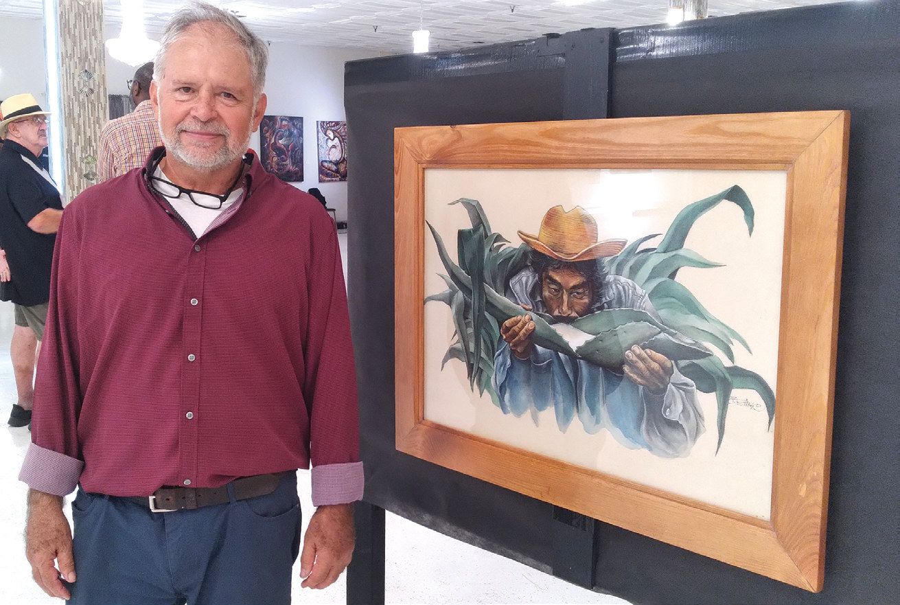 Alberto Rivas of Altamonte Springs with a detailed, colored pencil drawing by his late father, Francisco Rivas