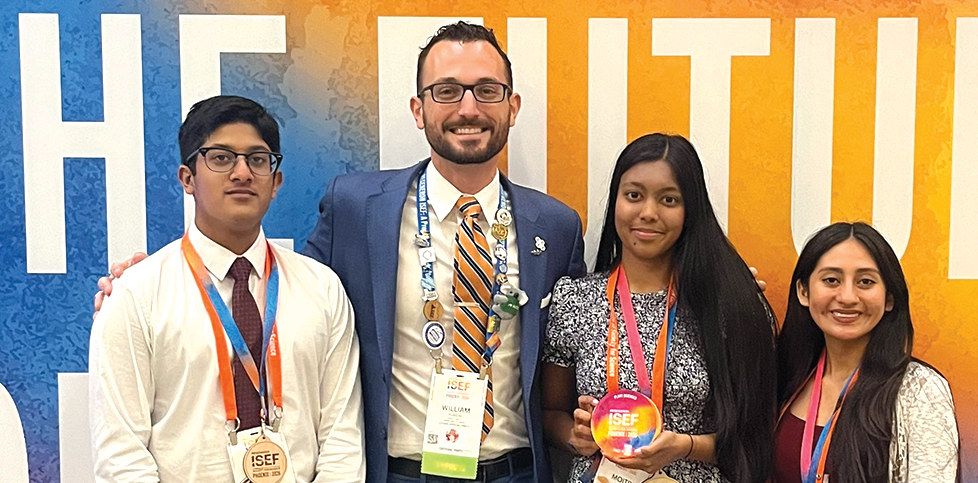 Oviedo High School teacher William Furiosi with students Ankan Das, Moitri Santra, and Angela Calvo-Chumbimuni at the 2026 Regeneron International Science and Engineering Fair.