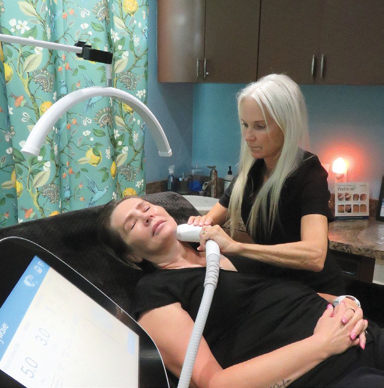 Selena Rocker tests the new Sofwave technology on Susan Haynes, the practice manager.