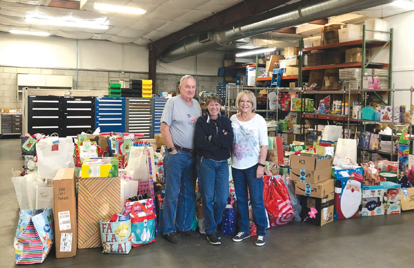 Bob Downing with Yvonne Stimac and Faith Shorthouse of Seminole County Friends of Abused Children. Bob and his wife help the nonprofit organize its gift requests for children each year.