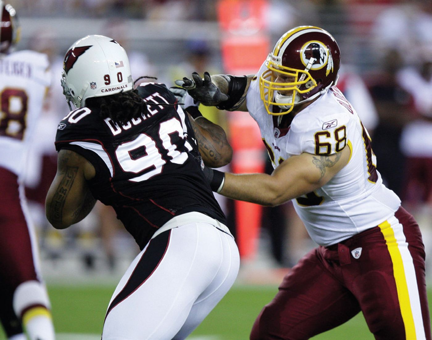 < Clint during his playing days with the Washington Redskins