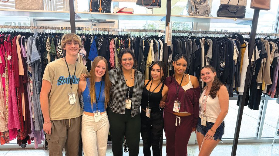 Team members at Uptown Cheapskate Oviedo, located just minutes from UCF