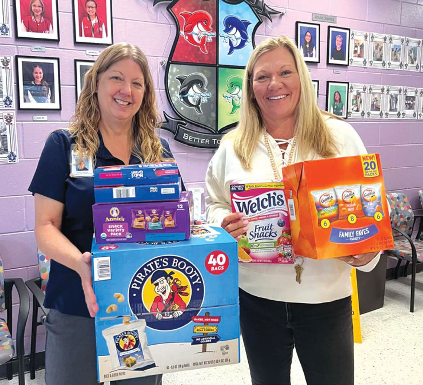 > Charlotte Little, principal of Lake Mary Elementary School, with Lynette Borneman, assistant principal, are happy to receive donated snacks from Snacks4Students.