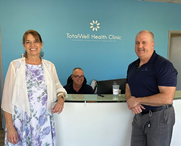 Dr. Joan Coupland, front desk team member Scott Hoffman, and Dr. Joseph Johnson