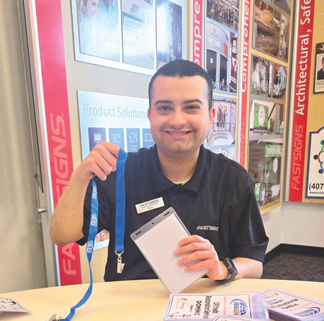 < Ben Shaffer, a 2024 RAISE graduate, stays busy with his job at FASTSIGNS.