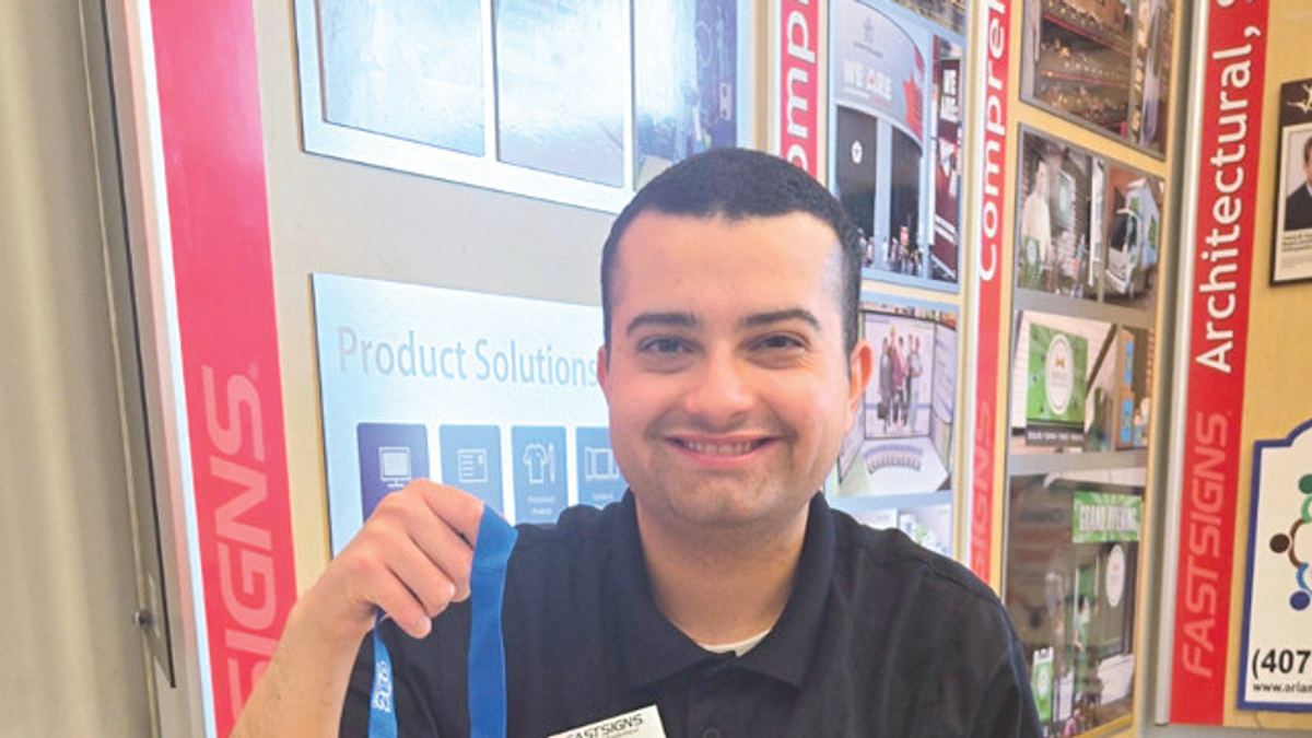 < Ben Shaffer, a 2024 RAISE graduate, stays busy with his job at FASTSIGNS.