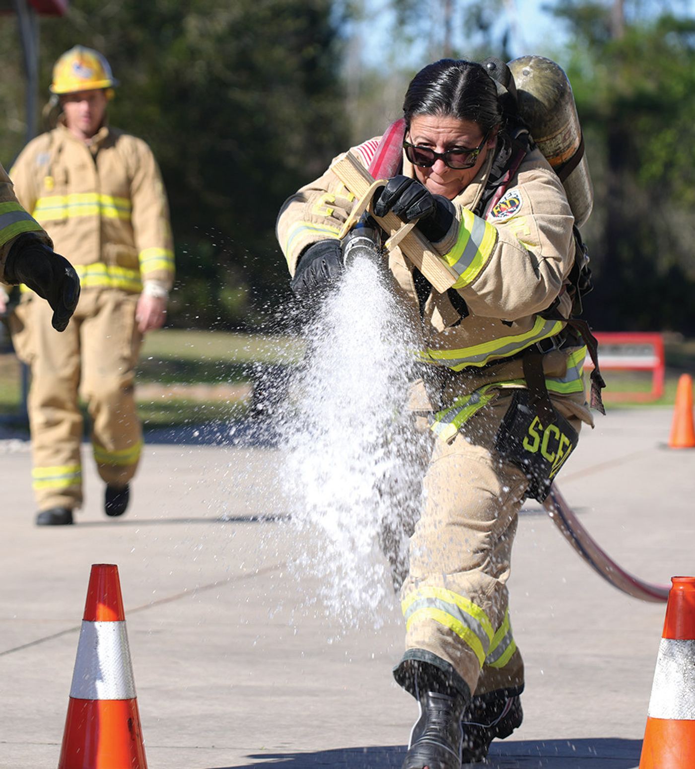 Assistant Chief Jolene Joyce of the Fire Department trains to compete in the All American