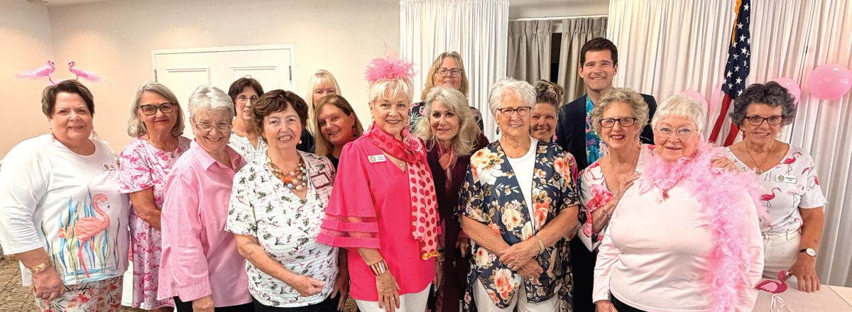 < Central Florida Spokes board members and special guest Jason Guy of WESH-2 News at the group’s Flamingo Bingo fundraiser