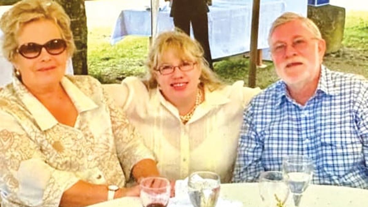 Emma Dixon with her parents Ingrid and John