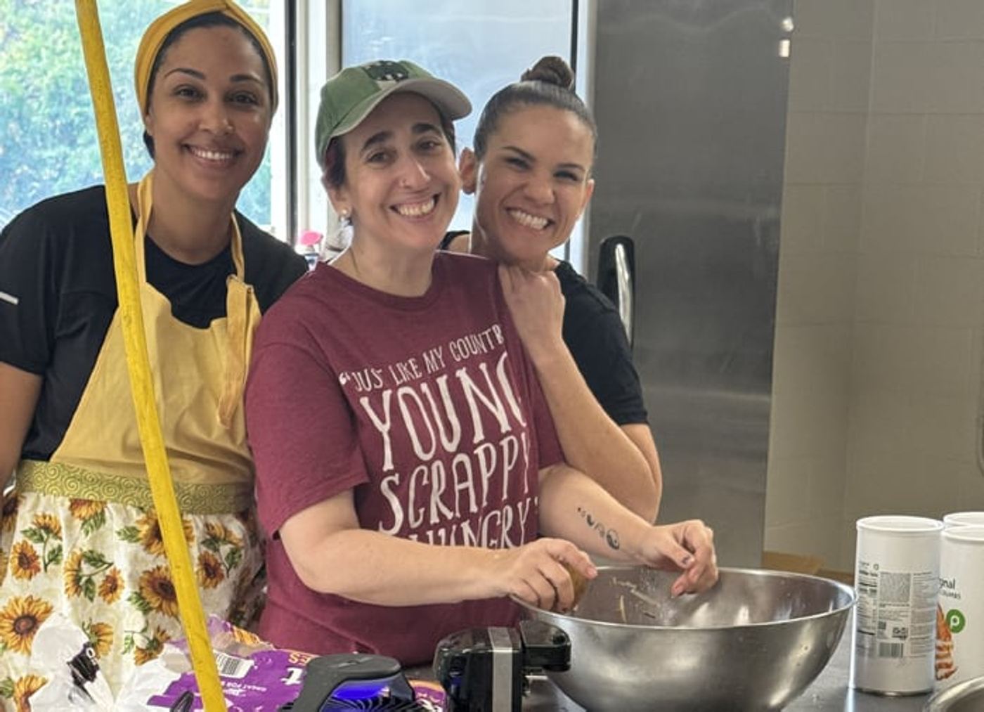 Alicia Kube, Amy Cores, and Sandy Sabag in the kitchen
