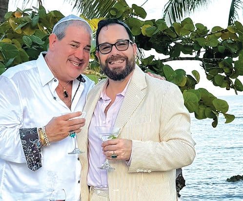 Rabbi Shai Specht-Sandler and his husband Jeff