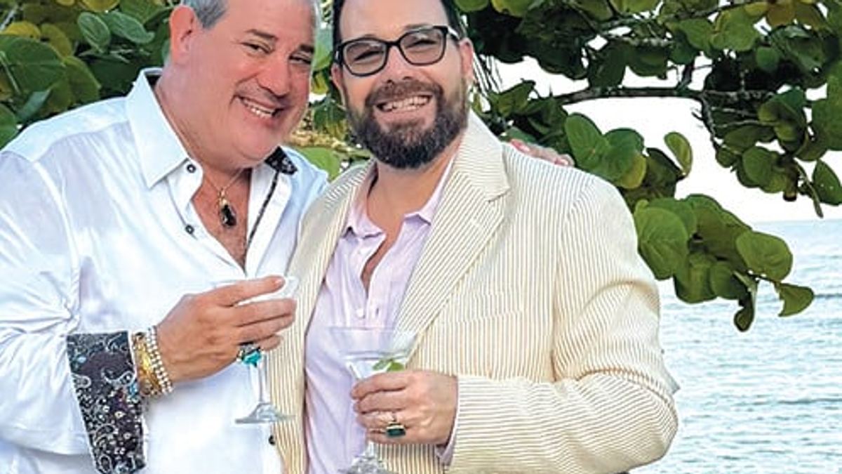 Rabbi Shai Specht-Sandler and his husband Jeff