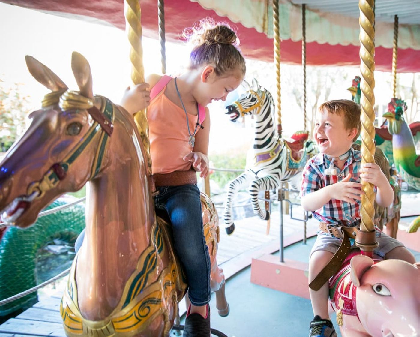 Children riding the carousel at Give Kids the World Village