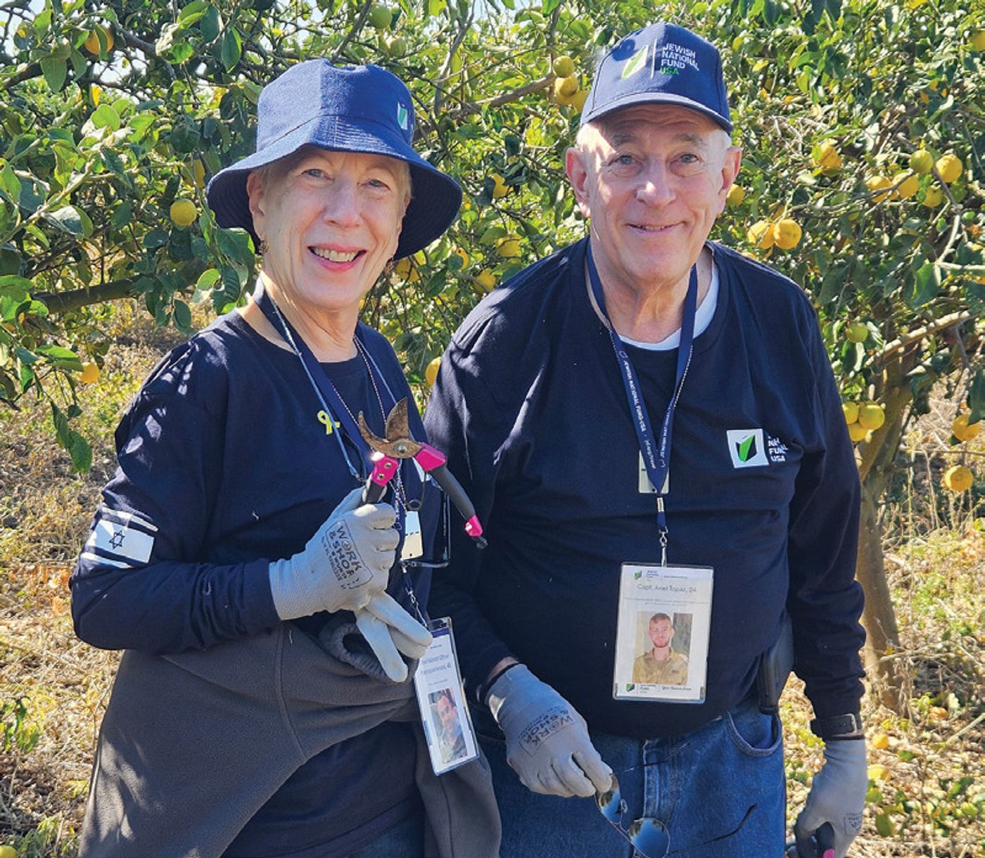 Debbie and Larry Meitin pruning lemon trees