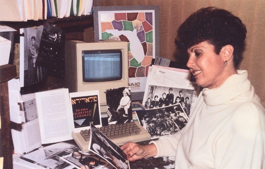 Marcia Jo Zerivitz at a vintage Macintosh computer
