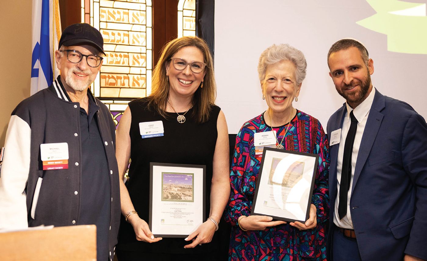 Dr. Michael Beim and Harrison Shames present WFI co-chairs Leah Silver and Debbie Meitin with planted trees in Israel as a token of appreciation.