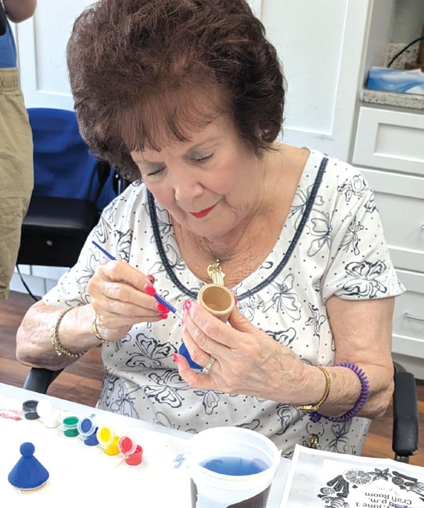 A resident paints during a Jewish Pavilion program