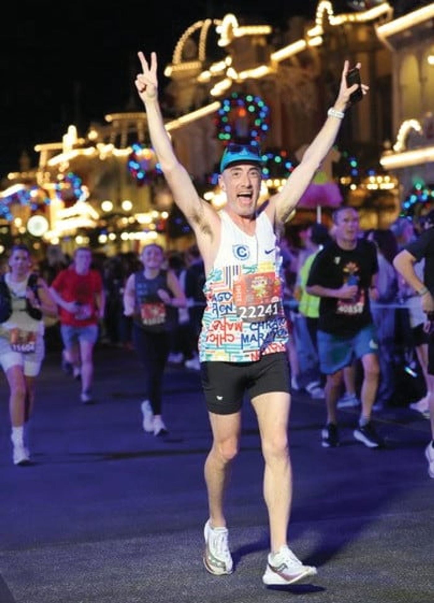 A runner celebrating mid-race at Walt Disney World