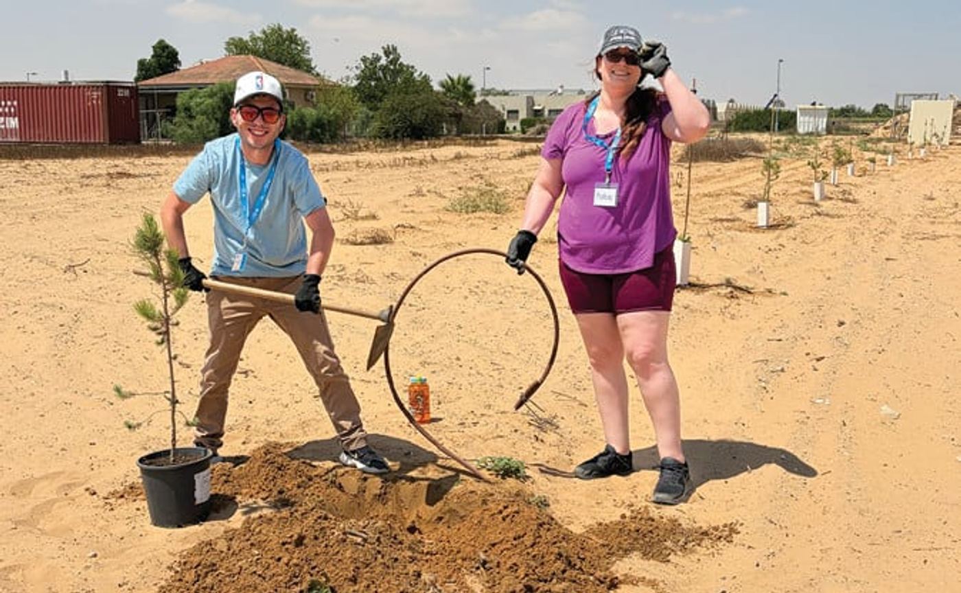 Ben and Katie planting trees