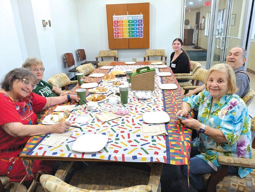 Seniors gather around a table for a Jewish Pavilion arts program